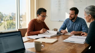 Charter school administrator reviewing California state budget documents and planning intervention spending decisions for the 2026 fiscal year