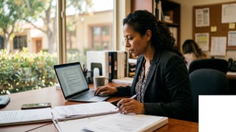 California NCB charter school director reviewing vendor contract line items on a laptop while preparing for the AB 126 contractor policy adoption deadline.