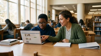 Middle school student in a small-group reading intervention session working with a tutor on a laptop at a school library table